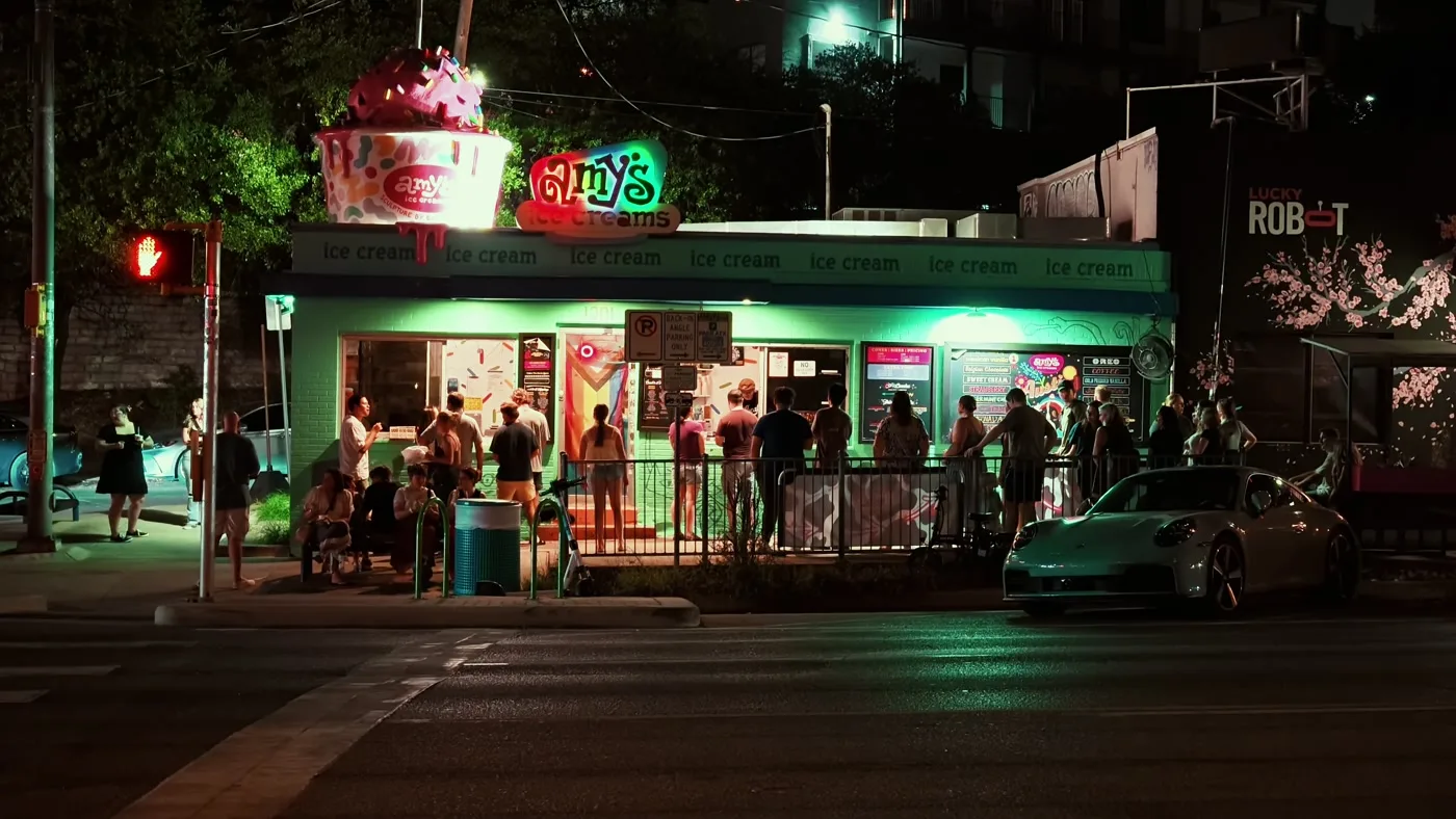 Amy’s Ice Cream on South Congress at night, a crowd at the window, from a Pieter Studio shoot.
