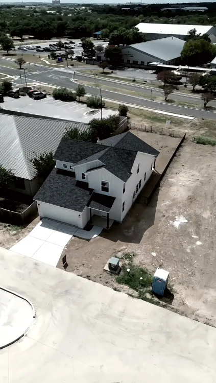 Aerial of a townhome community and its pool, then the rooms inside.